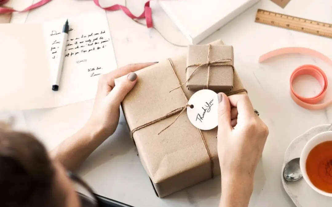 Woman holding a wrapped gift box.