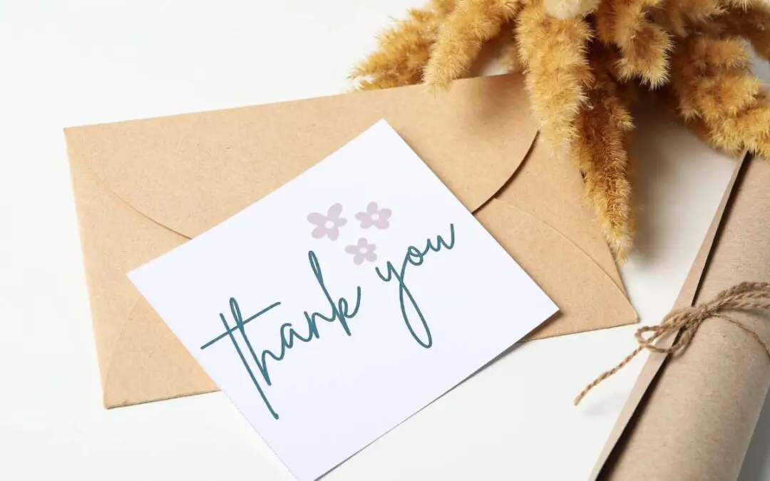 A thank you card with brown envelope.