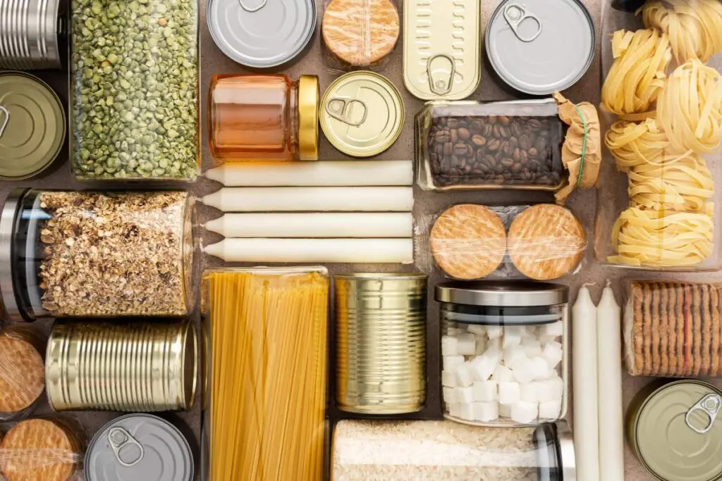 A collection of various food items organized in indoor storage containers.